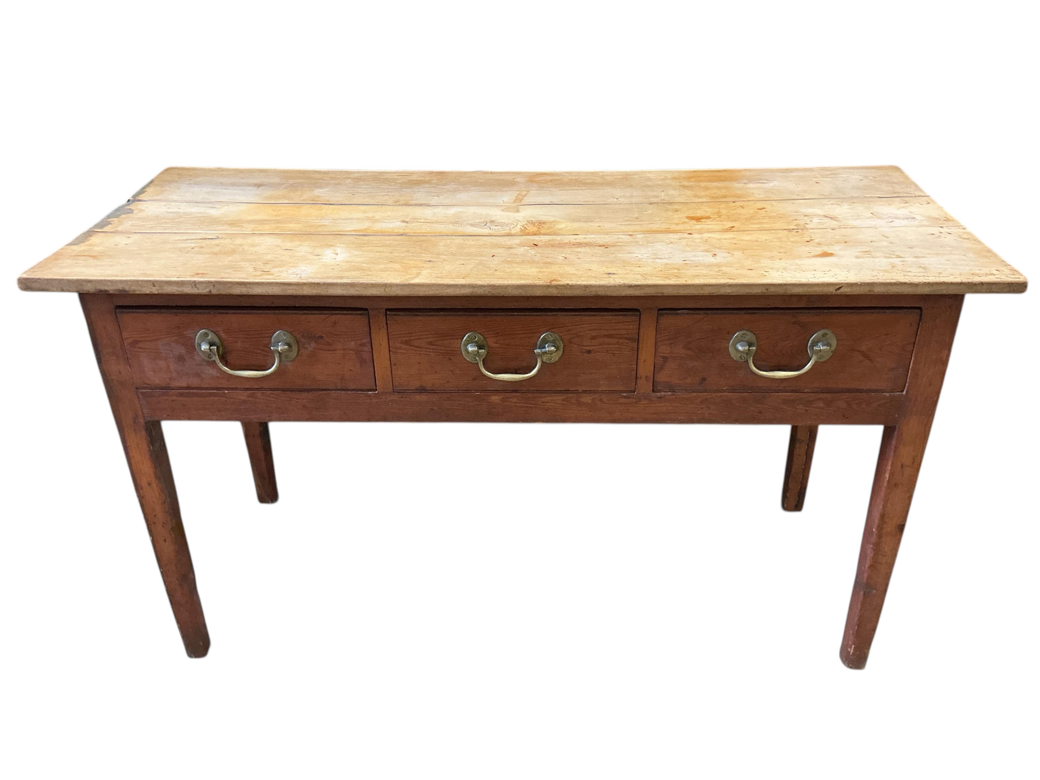 An early 19th century pine and fruitwood three drawer serving table, width 137cm, depth 54cm, height 75cm